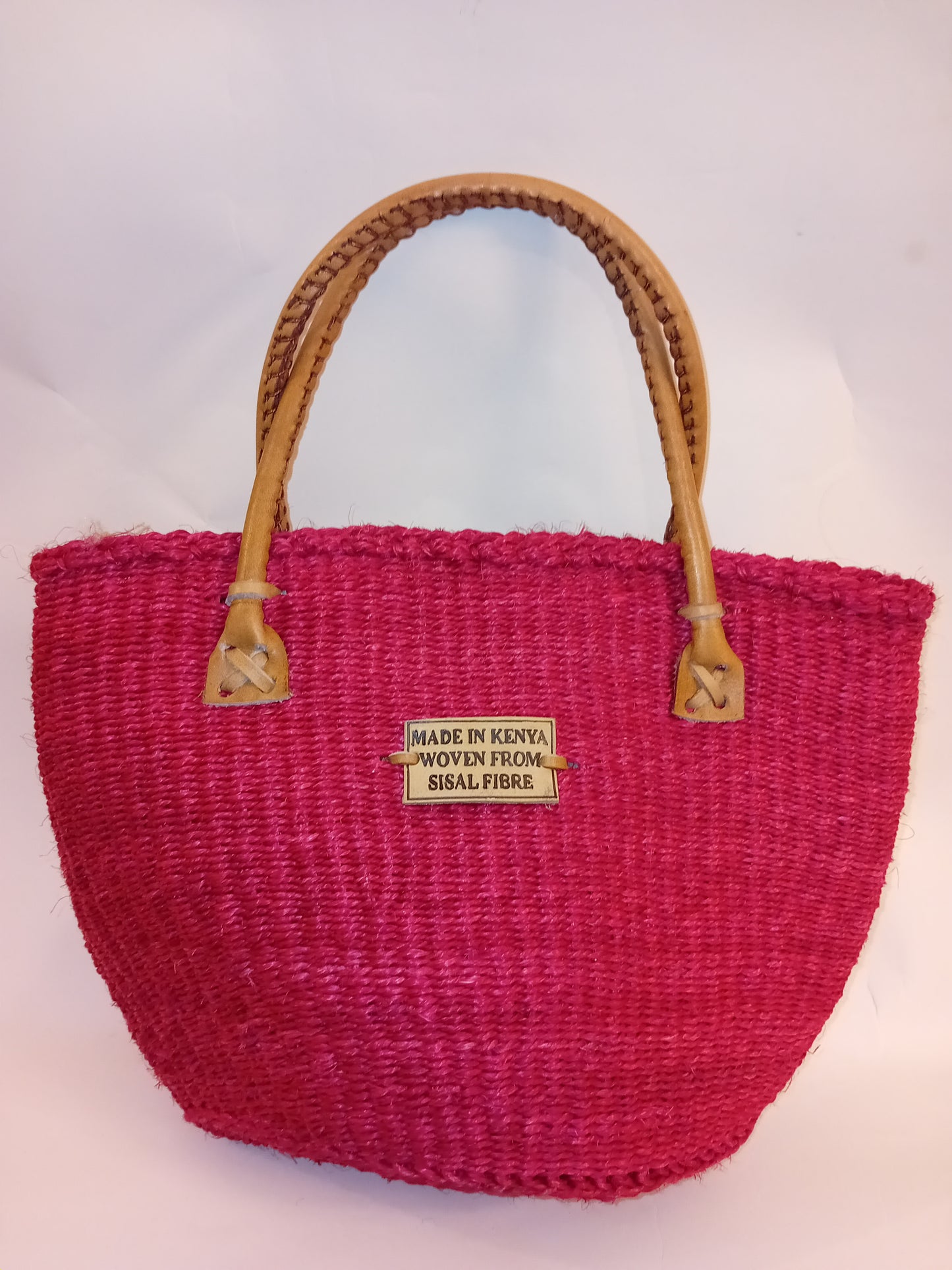 Small handbag style Handwoven Kenyan basket bag with leather handles