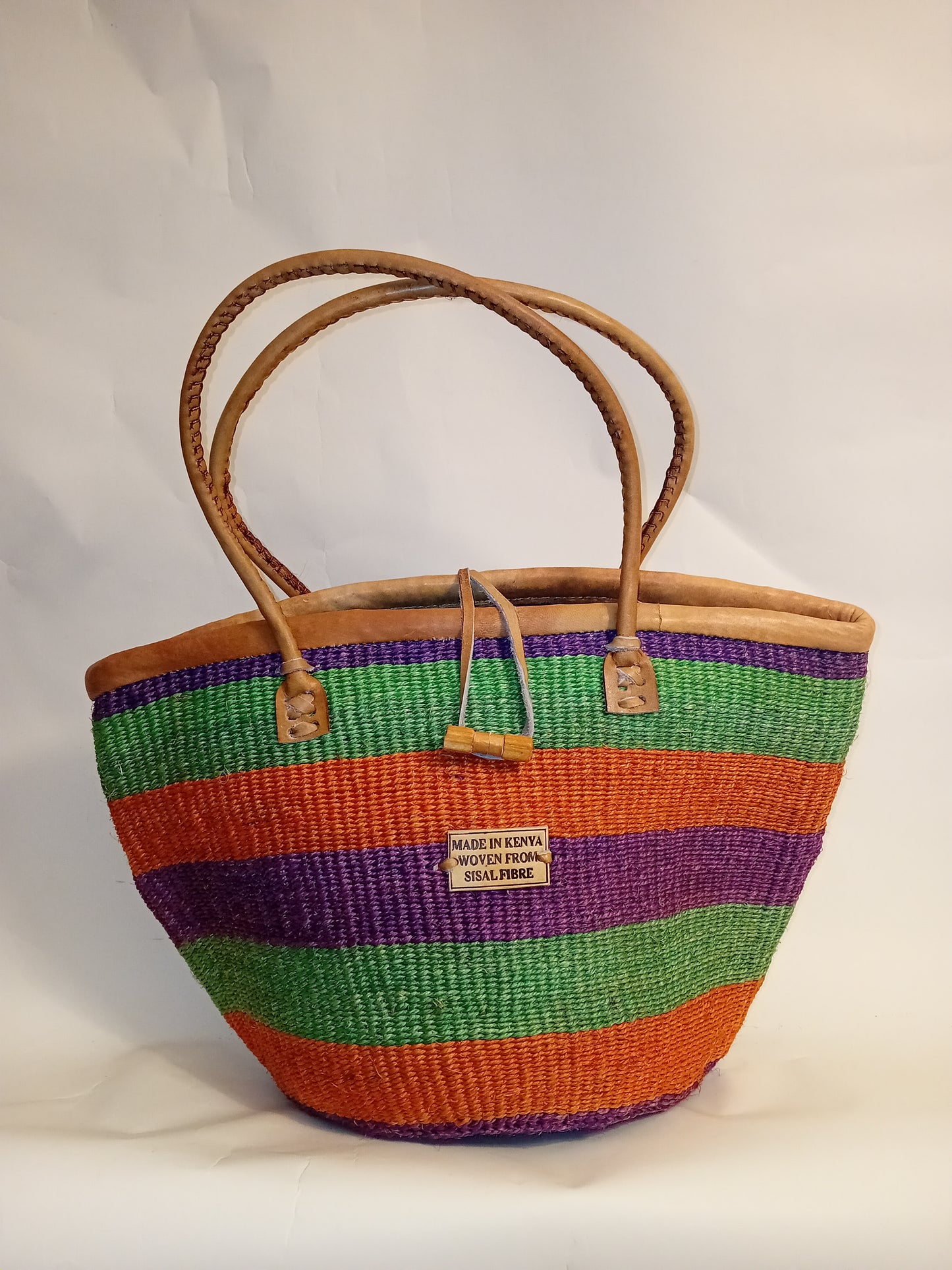 Multicoloured Handwoven Kenyan large basket bag with leather trim and toggle